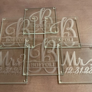 May include: Six glass coasters with etched designs. The coasters feature the letters "B" and "Mr" and "Mrs" with the last name "BOFFOLI" and the date "12.31.23".