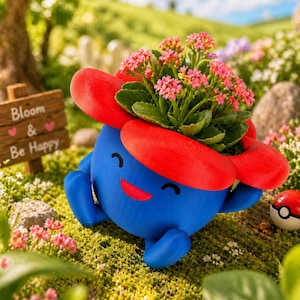 May include: A blue planter shaped like a cartoon character, with red accents and a smiling face, holds pink flowering plants. A small wooden sign reads "Bloom & Be Happy". A red and white ball is in the background.