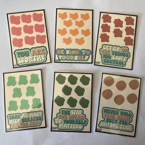May include: Nine colorful stickers with positive affirmations and abstract shapes. The stickers feature phrases like "You are worthy", "Be kind to yourself", "Let go of the things you can't control", "Take as many deep breaths as you need", "The way you speak to yourself matters", and "Never dull your shine just for anyone else".