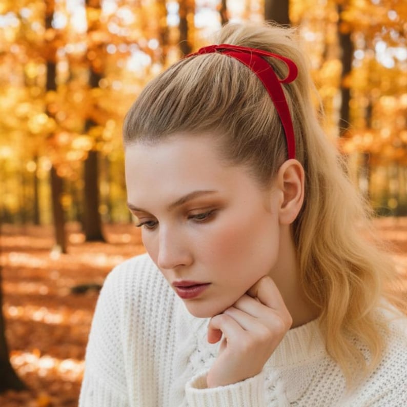 a velvet hair bow made with thin velvet ribbon in a long tail design attached to a french barrette clip, shown as a long tail hair bow suitable as a hair bow for women and hair bows for girls. the shape works as a ribbon hair bow or hairpin bow clip, styled like a ponytail holder bow or long ribbon bow. ideal as a christmas hair bow and fits gifting needs such as gift for her or gift for girl.