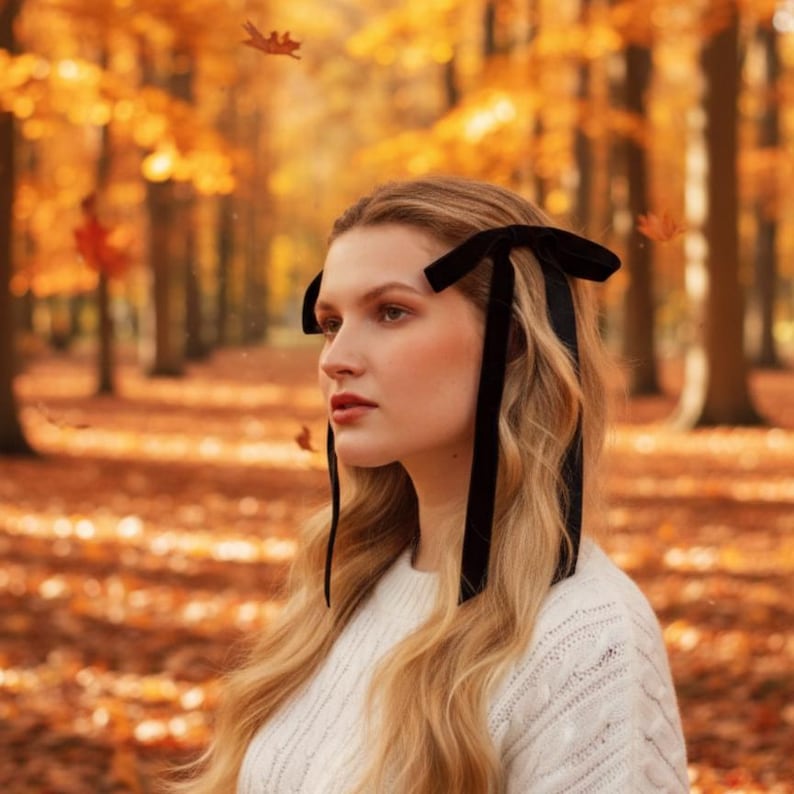 a velvet hair bow made with thin velvet ribbon in a long tail design attached to a french barrette clip, shown as a long tail hair bow suitable as a hair bow for women and hair bows for girls. the shape works as a ribbon hair bow or hairpin bow clip, styled like a ponytail holder bow or long ribbon bow. ideal as a christmas hair bow and fits gifting needs such as gift for her or gift for girl.