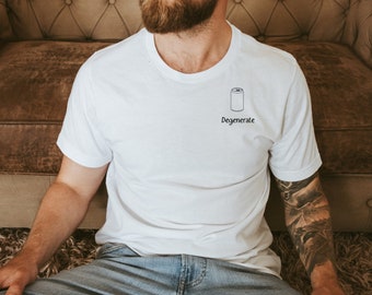 May include: White t-shirt with a small black illustration of a can and the word "Degenerate" printed below it. The shirt is short-sleeved and has a crew neck.