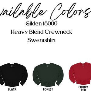 May include: Image of a Gildan 18000 Heavy Blend Crewneck Sweatshirt, available in white, black, forest green, cherry red, and sand colors. The text "Available Colors" is at the top, with the brand name and product details below.