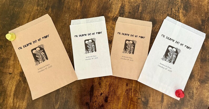 May include: Four paper favor bags with the text "Til Death Do Us Part" and a skeleton couple graphic. The bags are in shades of brown and white, with the wedding date printed below the graphic.
