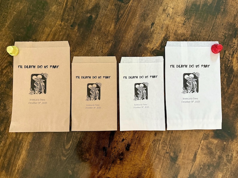 May include: Four paper favor bags with the text "Til Death Do Us Part" and a skeleton couple graphic. The bags are in shades of brown and white, with a decorative closure on two of them. The date "October 31, 2025" is printed below.