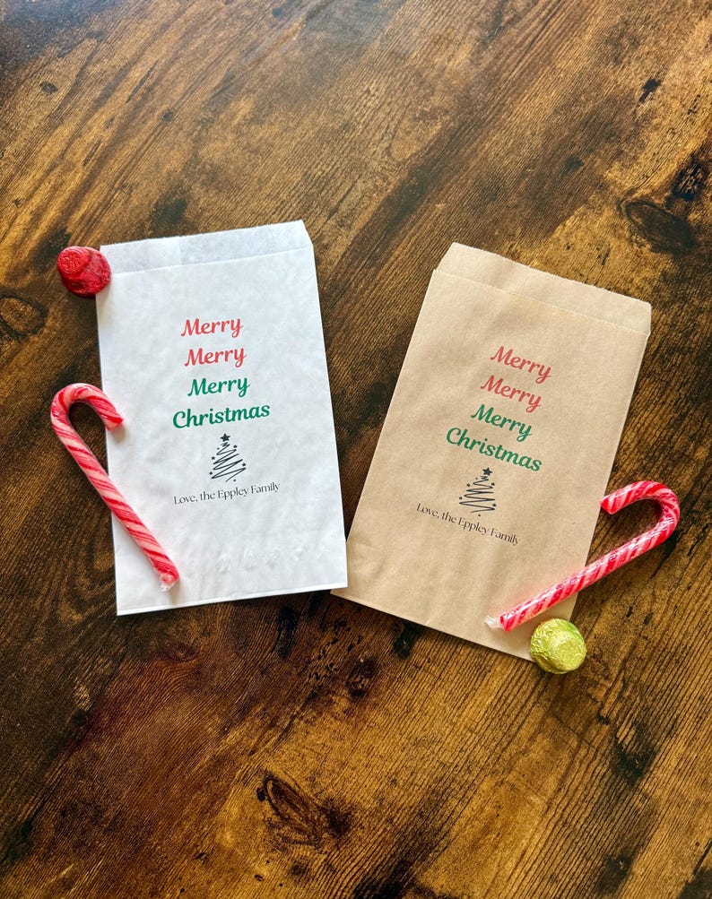 May include: Two Christmas-themed gift bags, one white and one brown, with the words "Merry Christmas" printed in red and green. Each bag has a candy cane and a piece of candy next to it. The bags also have the text "Love, the Eppley Family".