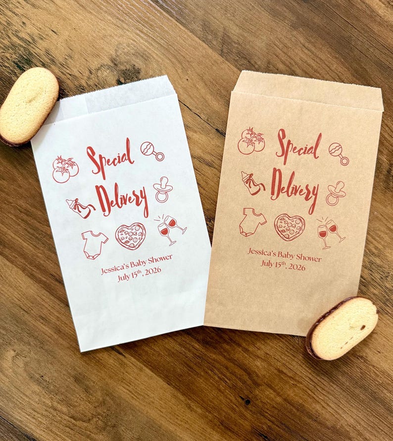 May include: Two rectangular paper bags, one white and one brown, featuring red printed graphics of tomatoes, a baby rattle, a baby bottle, a pacifier, a onesie, a heart-shaped pizza, and two wine glasses with the text Special Delivery.