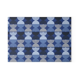 May include: A repeating pattern of blue, gray, and black semi-circles. The pattern is a geometric design with a modern feel.