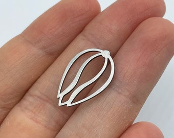 May include: A silver metal charm shaped like a stylised flower with two layers of petals.