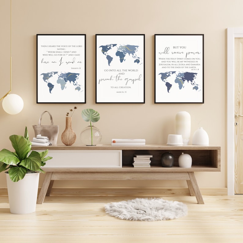 May include: Three framed prints with a world map design and inspirational quotes from the Bible. The quotes are "Then I heard the voice of the Lord saying, 'Whom shall I send, and who will go for us?' And I said, 'Here am I. Send me.'"  "Go into all the world and preach the gospel to all creation."  "But you will receive power when the Holy Spirit comes on you, and you will be my witnesses in Jerusalem and in all Judea and Samaria, and to the ends of the earth."