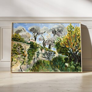 May include: A framed painting depicting a landscape with trees and a blue sky. The trees are painted in shades of green, yellow, and brown. The sky is a light blue with white clouds. The painting is signed in the bottom left corner.