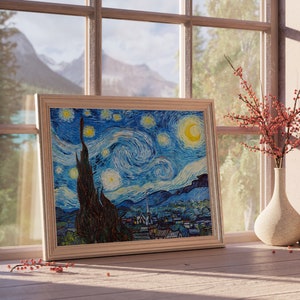 May include: A framed print of Vincent van Gogh's "Starry Night" painting, featuring a swirling blue sky with white stars and a crescent moon. The print is displayed on a wooden table with a vase of red berries and a small decorative object.