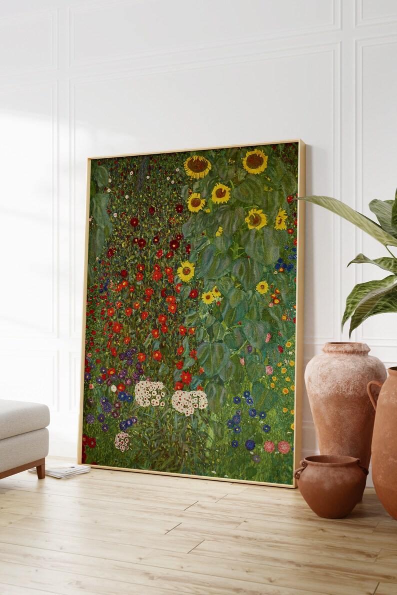 May include: A painting of a field of flowers with sunflowers in the background. The flowers are in shades of red, pink, white, blue, and yellow. The sunflowers are in shades of yellow and green. The painting is framed in gold.