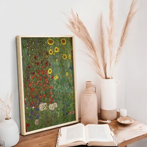 May include: A framed print of a painting depicting a field of sunflowers and other wildflowers in shades of green, yellow, red, and blue.
