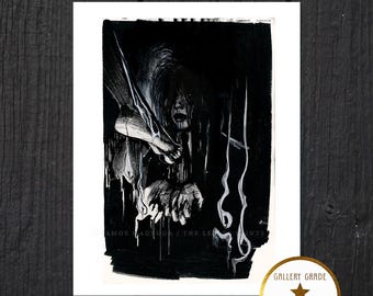 May include: Black and white art print featuring a haunting illustration of a figure with long hair and outstretched hands. The print is on archival paper and ink, with text that reads "AMOS NADUGA / THE LEGENDS". A gold sticker reads "GALLERY GRADE ARCHIVAL PAPER AND INK".