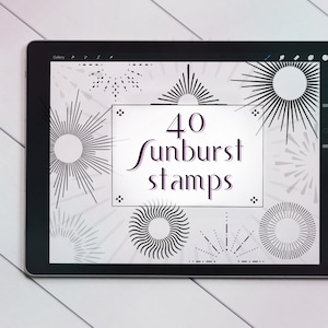 May include: A digital tablet displays a collection of 40 sunburst stamps in black and white. The text "40 Sunburst Stamps" is centered on the screen. A white stylus rests on the left side of the tablet, and the background is a white wooden surface.