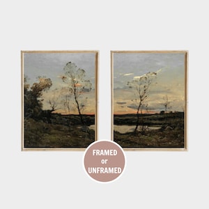 May include: A set of two rectangular landscape paintings featuring a twilight sky over a grassy field with sparse trees and a small body of water. The artwork is presented in light-colored wooden frames. A circular badge displays the text FRAMED or UNFRAMED.