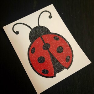 Lady Bug Decal with a glittery black body and glittery red wings