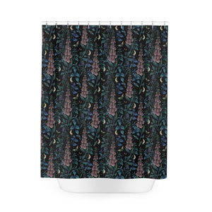 May include: A black shower curtain with a repeating pattern of pink, blue, and green flowers, crescent moons, and small butterflies.