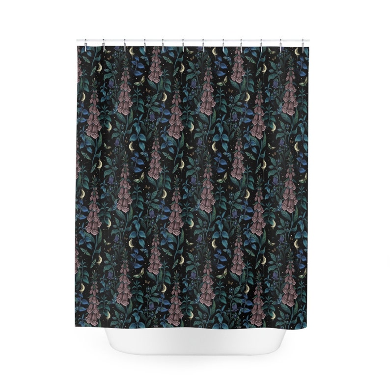 May include: A black shower curtain with a repeating pattern of pink, blue, and green flowers, crescent moons, and small butterflies.