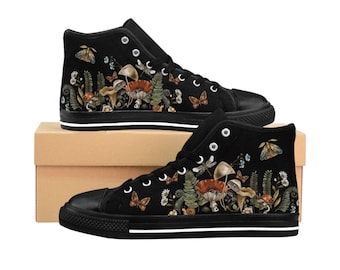 May include: Black high-top canvas shoes with a colorful floral and mushroom design. The shoes have white laces and a white rubber sole.