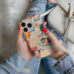 May include: A colorful phone case with a collage design featuring text, illustrations, and floral elements. The case includes the phrases "Trust the Universe," "Let go of the thoughts that don't make you strong," and "And suddenly you just know it's time to start something new and trust the magic & beginnings."