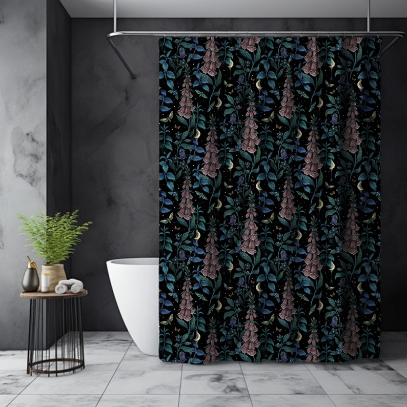 May include: A black shower curtain with a floral pattern featuring pink and blue foxglove flowers, green leaves, and crescent moons.