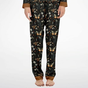 May include: Black pajama pants with a dark floral print featuring butterflies and leaves.