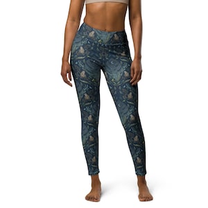 May include: Dark blue leggings with a repeating pattern of monkeys, leaves, and flowers.