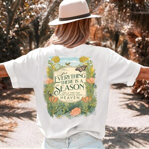 May include: White t-shirt with a floral design and the text "For everything there is a season and a time for every purpose under heaven."
