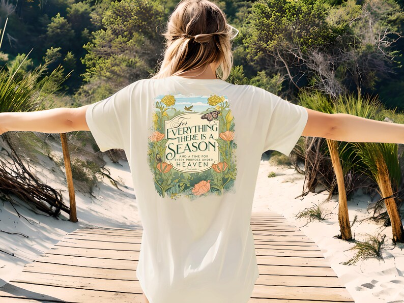 May include: A white t-shirt with a floral design and the text "For Everything There Is A Season And A Time For Every Purpose Under Heaven" printed on the back.
