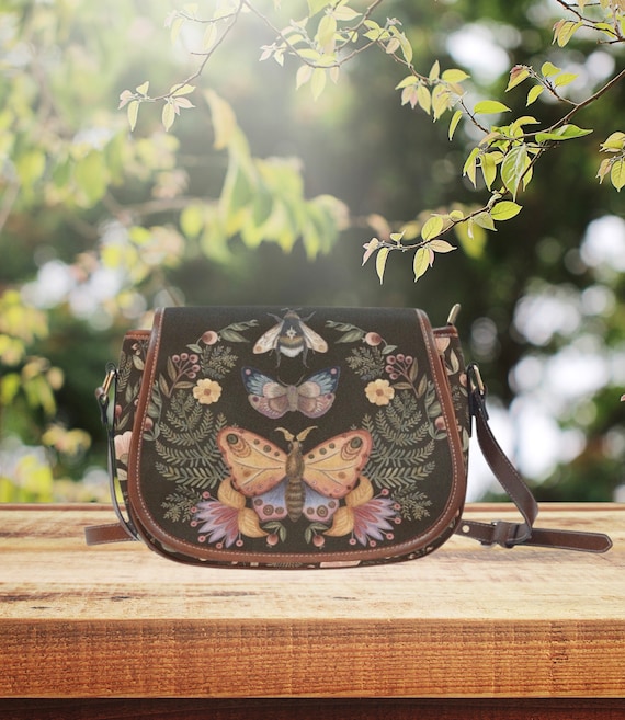 blue and brown leather backpack Leather-Accented Backpack in Blue
