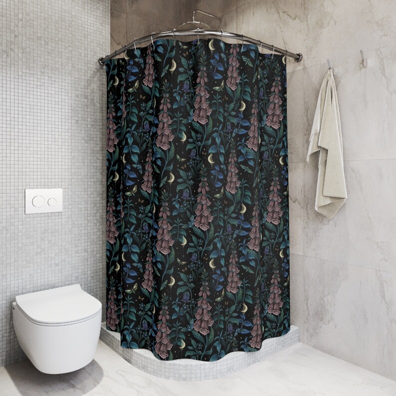 May include: A black shower curtain with a floral pattern featuring pink and blue flowers, green leaves, and gold crescent moons.