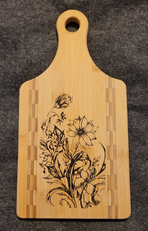 Flower themed paddle cutting board