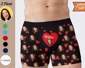May include: Black boxer shorts with a red heart pattern and the text "Mine" in white. The heart pattern includes multiple faces.
