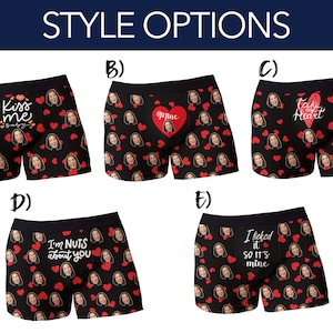 Op de afbeelding: Zwarte boxershorts met een herhaald patroon van gezichten en rode harten. Elke broek heeft een andere romantische zin: "Kiss me baby", "Mine", "Take my heart", "I'm nuts about you" en "I licked it so it's mine".