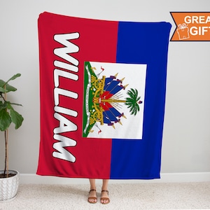May include: A red and blue fleece blanket with the Haitian flag and the name "William" printed in white.