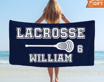 May include: A navy blue beach towel with white text that reads "LACROSSE WILLIAM 6" and a white lacrosse stick graphic.