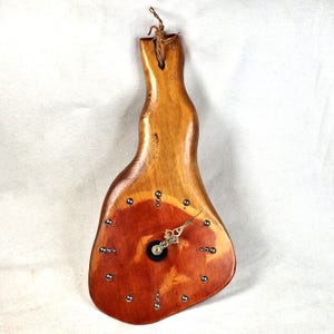 Rustic pine wood wall clock with rivet hour markers, handmade for hunting cabin or lodge, rugged Norwegian decor gift for outdoorsmen