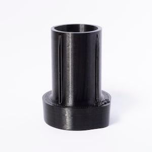 May include: A black plastic 3D printed adapter with a cylindrical shape and a slightly flared base.