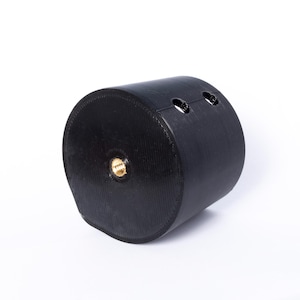 May include: Black rubber roller with a threaded hole in the center and two small holes on the side.