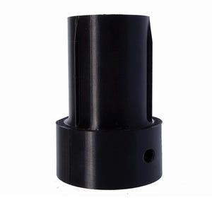 May include: A black cylindrical object with a wider base and a narrower, taller top. A small hole is visible on the side of the base. The object is made of a solid, opaque material.