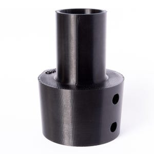 May include: Black plastic adapter with a round base and a cylindrical top. The base has two holes.