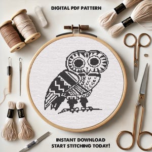 May include: Black and white cross stitch pattern of an owl in a wooden embroidery hoop. The pattern is for a digital download and includes the text "Instant Download Start Stitching Today!"