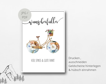 May include: A printable template for a money gift. The template features a bicycle with flowers in a basket and wheels made of euro bills. The text "Wunscherfüller" is at the top of the template. The text "VIEL SPASS & GUTE FAHRT" is below the bicycle. The text "Drucken, ausschneiden, Geldscheine hinterlegen & hübsch einrahmen" is on the right side of the template.