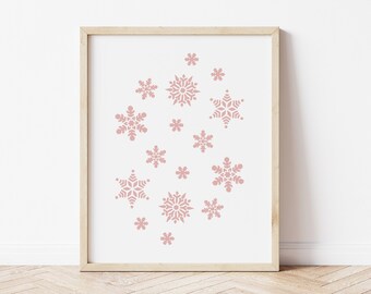 May include: A framed print with a white background and a design of pink snowflakes of varying sizes.