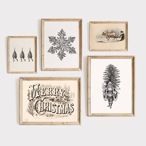 May include: A collection of framed vintage Christmas art prints. The prints feature a snowflake, Santa Claus, reindeer, and the words "Merry Christmas" in ornate lettering. The art is in black and white.