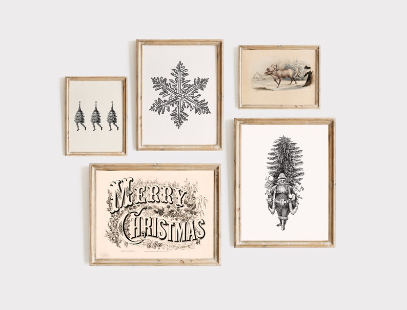 May include: A collection of framed vintage Christmas art prints. The prints feature a snowflake, Santa Claus, reindeer, and the words "Merry Christmas" in ornate lettering. The art is in black and white.