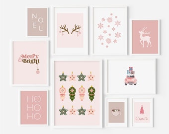 May include: A set of ten pink and white framed prints with various Christmas themes. The prints feature illustrations of reindeer, snowflakes, ornaments, a car with presents, a cup of hot chocolate, a Christmas tree, and text that says "Merry & Bright", "Ho Ho Ho", and "Noel".