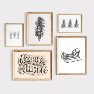 May include: A collection of framed Christmas-themed art prints. The prints feature black and white illustrations of Santa Claus, a sleigh, Christmas trees, and the words "Merry Christmas" in an ornate font. The frames are a light wood color.